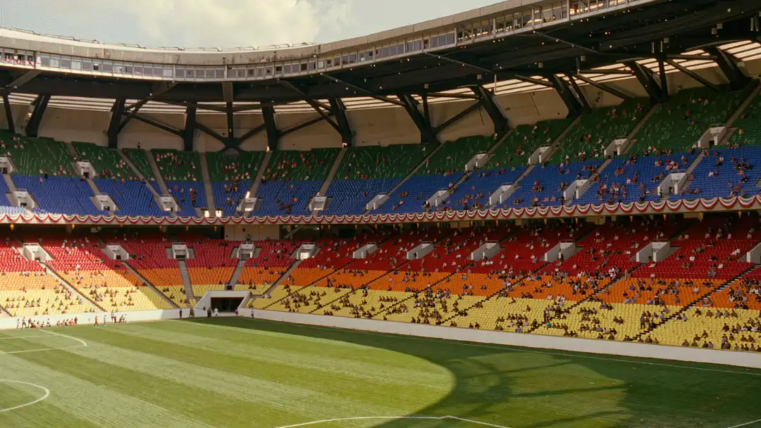 Vintage 1990s American stadium with colorful seats set up for soccer