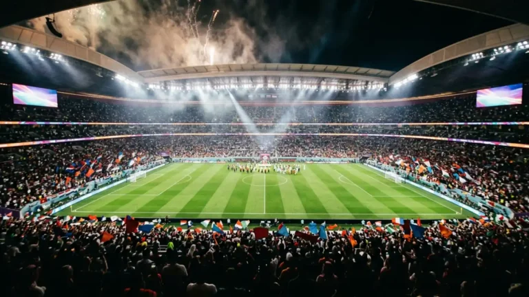 Floodlit stadium packed with fans waving colorful flags on World Cup opening night